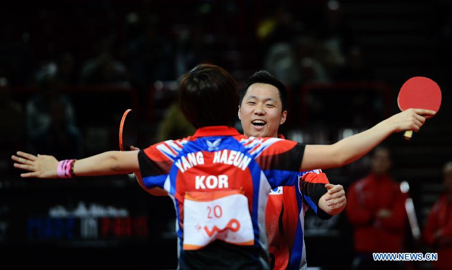 Cho Eonroe and Yang Ha-eun (front) of South Korea celebrate after the round of 16 of mixed doubles against Chen Qi and Hu Limei (R) of China at the 2013 World Table Tennis Championships in Paris, France on May 16, 2013. Cho Eonroe and Yang Ha-eun won 4-3. (Xinhua/Tao Xiyi)