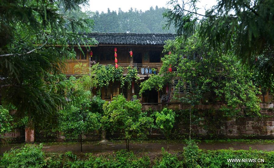 Photo taken on May 16, 2013 shows an ancient building in the Shangli Ancient Town in Ya'an City, southwest China's Sichuan Province. Most shops in the Shangli Ancient Town have resumed business after a 7.0-magnitude hit Ya'an on April 20. The picturesque Shangli Ancient Town is well-known for its elaborate architectural art. (Xinhua/Liu Xiao) 