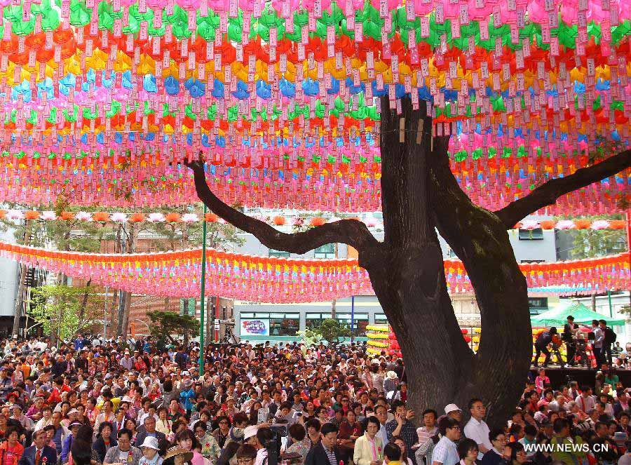 South Korean Buddhists pray during a service to celebrate the 2,557th birthday of Buddha at Chogye Temple in Seoul, South Korea, May 17, 2012. Buddha's birthday, falling on May 17 this year, is one of the most important public holidays in South Korea. (Xinhua/Yao Qilin)