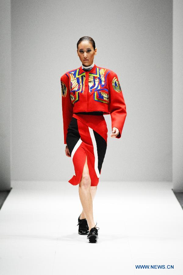 A model presents a creation by British designer Peter Pilotto during the Audi Fashion Festival held in Singapore's Marina Bay, May 18, 2013. (Xinhua/Then Chih Wey) 