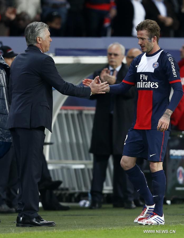 Paris Saint-Germain's English midfielder David Beckham shakes hands with manager Carlo Ancelotti after his substitution during a French League 1 football match between Paris St Germain and Brest at Parc des Princes stadium in Paris on May 18, 2013.(Xinhua/Wang Lili)