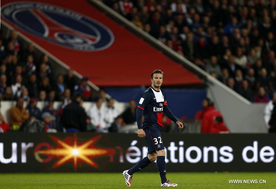 Paris Saint-Germain's English midfielder David Beckham looks on during the French League 1 football match between Paris St Germain and Brest at Parc des Princes stadium in Paris on May 18, 2013.(Xinhua/Wang Lili)