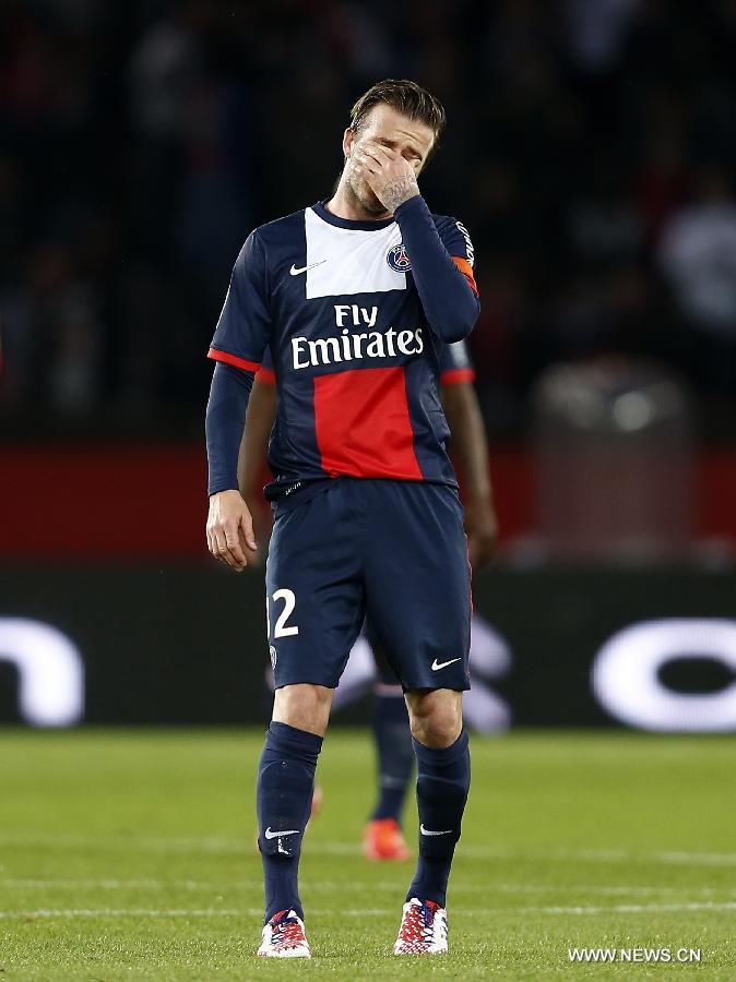 Paris Saint-Germain's English midfielder David Beckham reacts during the French League 1 football match between Paris St Germain and Brest at Parc des Princes stadium in Paris on May 18, 2013.(Xinhua/Wang Lili)