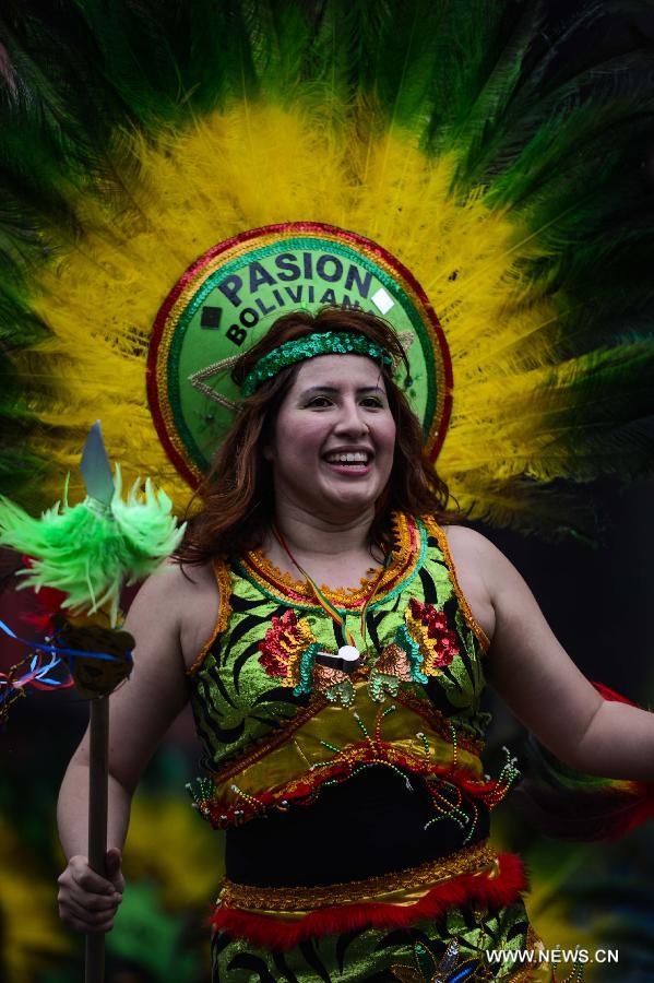 People participate in the annual Dance Parade in New York, on May 18, 2013. Over 200 dance groups showcasing 80 unique dance styles and cultures gathered from Broadway to the East Village on Saturday for the 7th Dance Parade in New York. (Xinhua/Niu Xiaolei) 