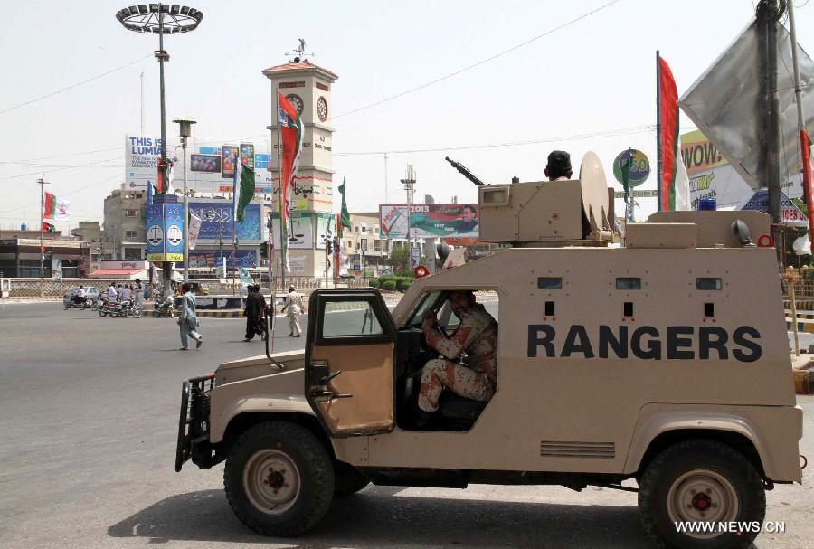 Pakistani rangers guard on a road during the partial re-run election in southern Pakistani port city of Karachi, May 19, 2013. Re-polling on a parliamentary seat started in Pakistan's port city of Karachi Sunday morning following allegations of rigging, officials said. (Xinhua/Arshad) 