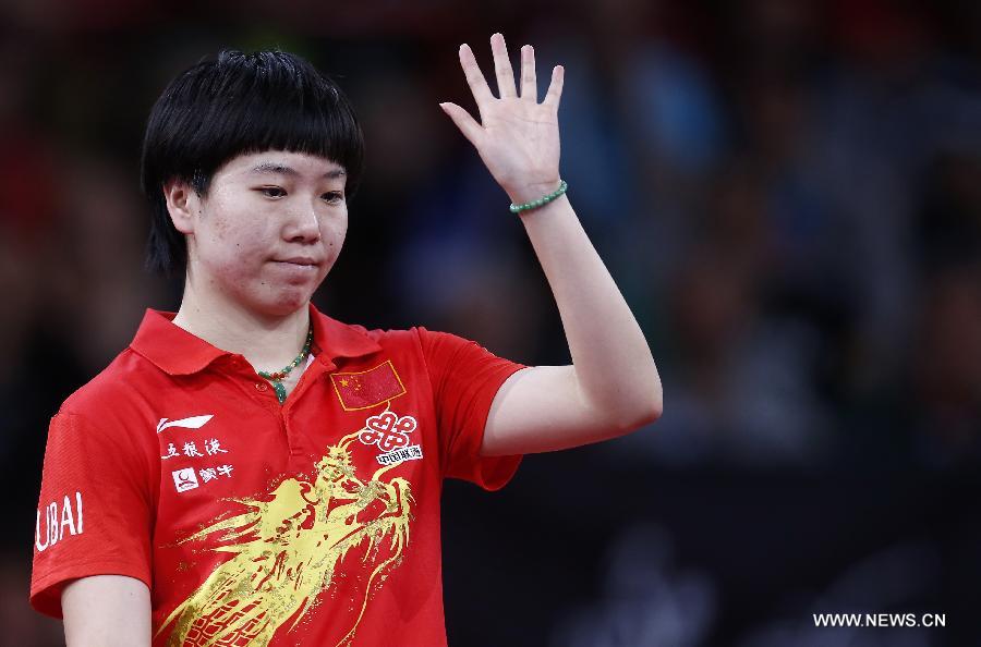 Li Xiaoxia of China reacts during semifinal of women's singles against her teammate Ding Ning at the 2013 World Table Tennis Championships in Paris, France on May 18, 2013. Li won 4-2. (Xinhua/Wang Lili)