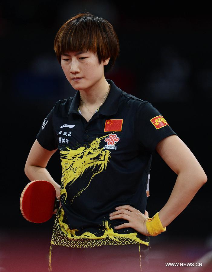 Ding Ning of China reacts during semifinal of women's singles against her teammate Li Xiaoxia at the 2013 World Table Tennis Championships in Paris, France on May 18, 2013. Ding lost 2-4. (Xinhua/Tao Xiyi)