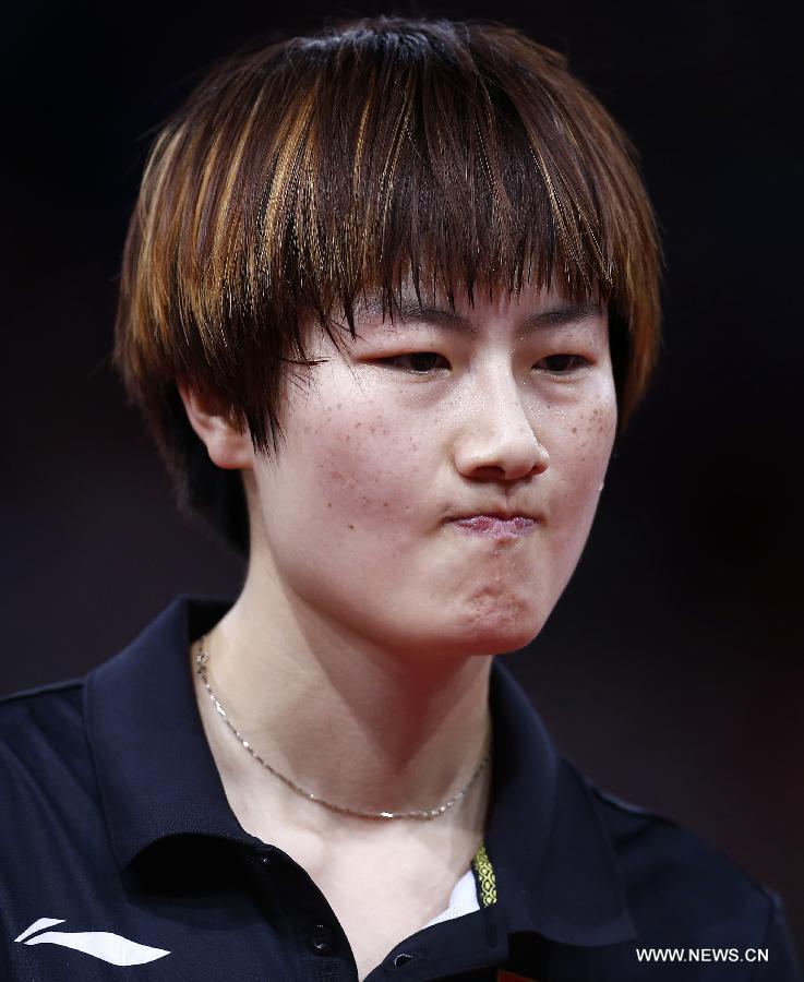 Ding Ning of China reacts during semifinal of women's singles against her teammate Li Xiaoxia at the 2013 World Table Tennis Championships in Paris, France on May 18, 2013. Ding lost 2-4. (Xinhua/Wang Lili)