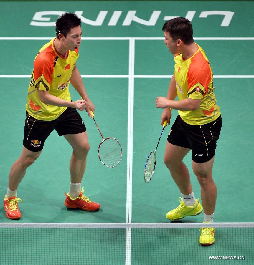 Liu Xiaolong(L) and Qiu Zihan of China celebrate for a point during the 2013 Sudirman Cup world mixed team badminton championship against India's Dewalkar Akshay and Chopra Pranaav Jerry in Kuala Lumpur, Malaysia, on May 19, 2013. Liu and Qiu won 2-0. (Xinhua/Chen Xiaowei)