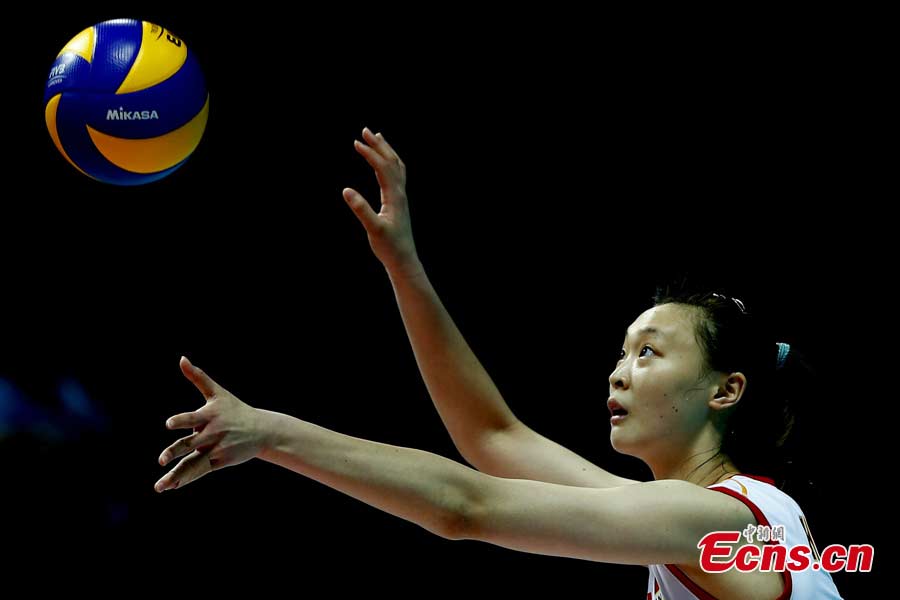 Chinese volleyball players are in a match against Puerto Rico in Ningbo, Zhejiang Province, May 19, 2013. The Chinese team, which was formed last week, proved a class above their opponents and won the match 25-12, 25-20, 25-14 in just one hour and 11 minutes at the Beilun International Volleyball Tournament. (CNS/Fu Tian)