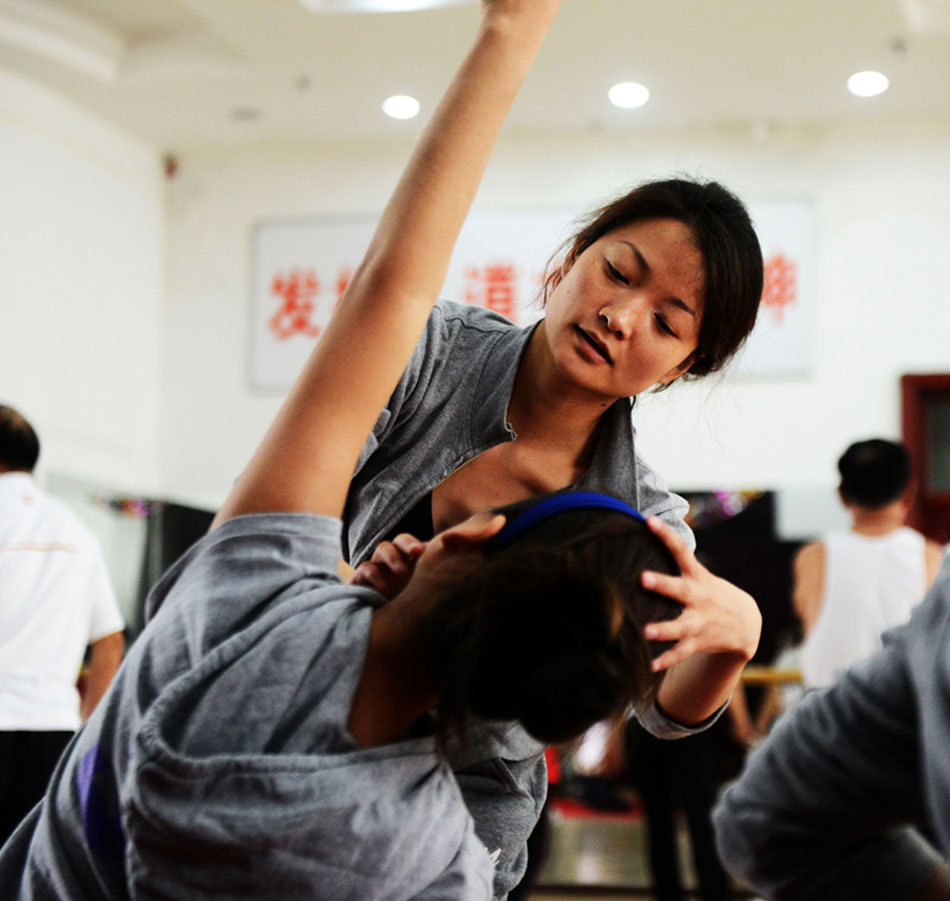 Hearing impaired dancers are in training in Harbin on May 14, 2013. Dancers of Harbin Disabled People's Performing Art Troupe dance team pursued their dancing dream in a silent world. (Xinhua/Wang Kai)