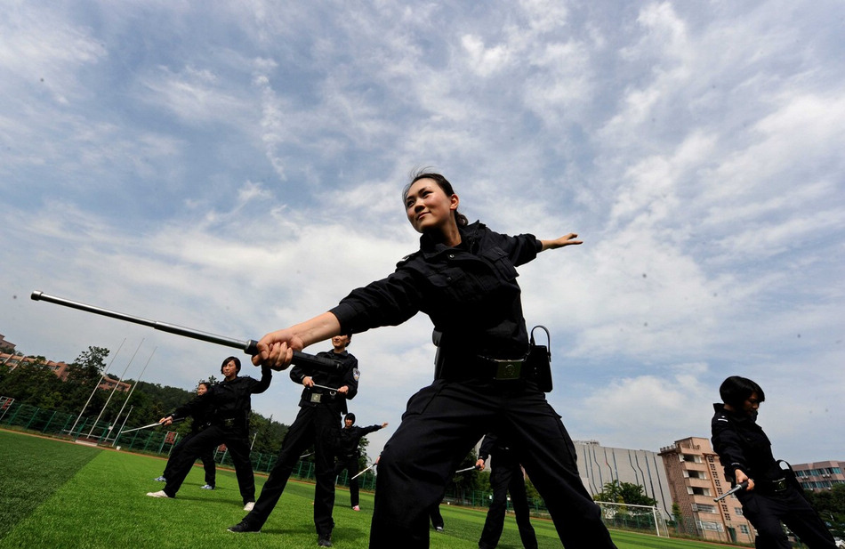 The woman students of Guizhou Police Academy receive training in Guiyang of Guizhou province on May 21, 2013. The students are going to complete their training courses and begin to serve very soon. (Photo/Imagine China)