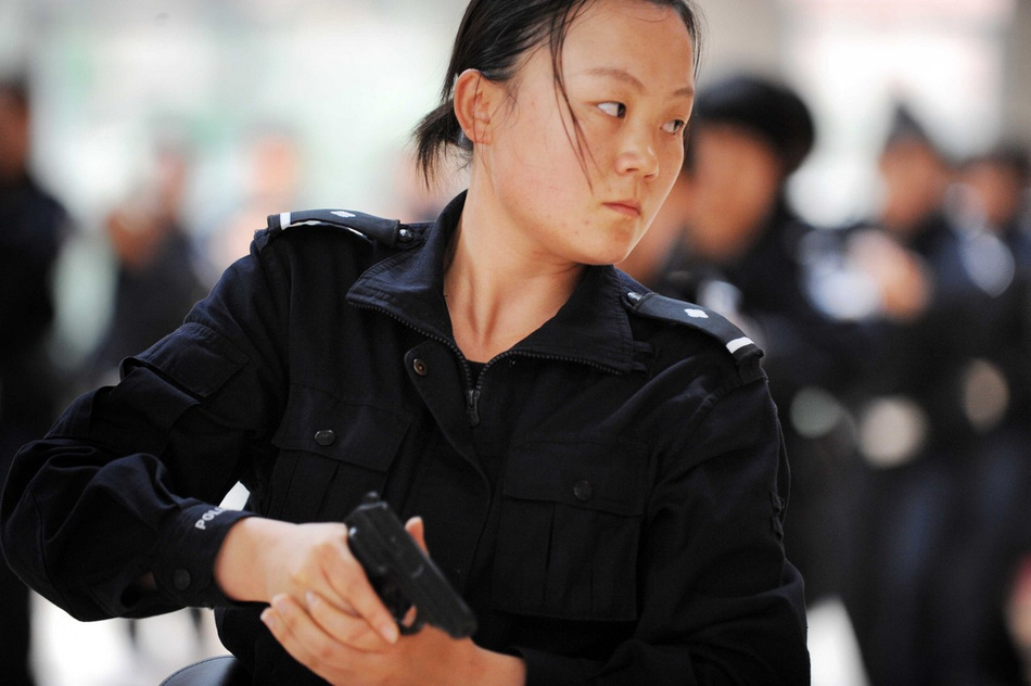 The woman students of Guizhou Police Academy receive training in Guiyang of Guizhou province on May 21, 2013. The students are going to complete their training courses and begin to serve very soon. (Photo/Imagine China)