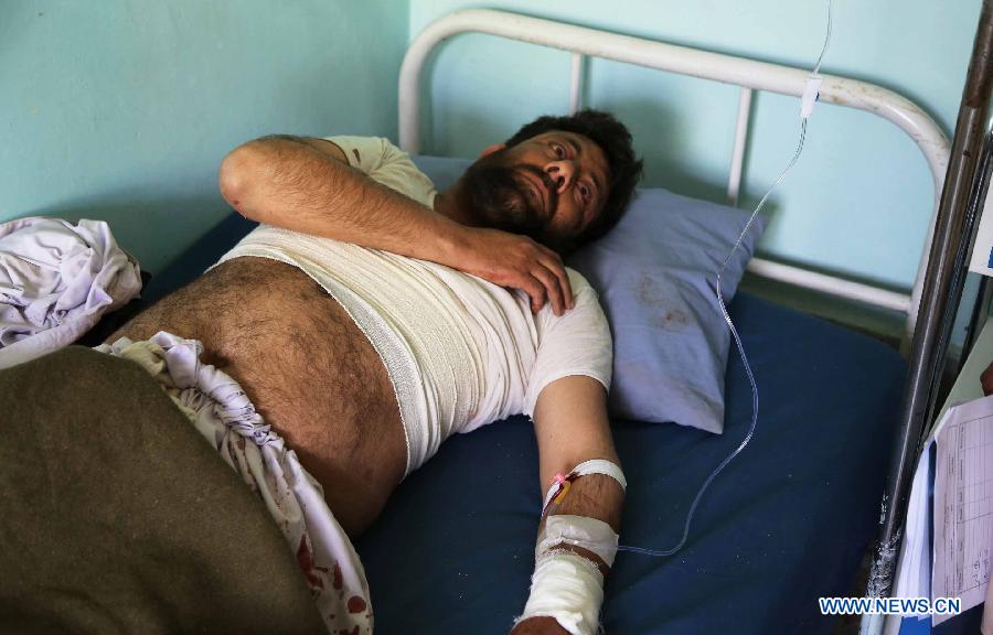 A wounded Afghan receives treatment at a hospital in Ghazni province, east Afghanistan, on May 22, 2013. One Afghan civilian was killed and five others were wounded Wednesday morning when an improvised bomb went off in Ghazni city, the provincial capital of eastern Ghazni province, police said. (Xinhua/Rahmat)