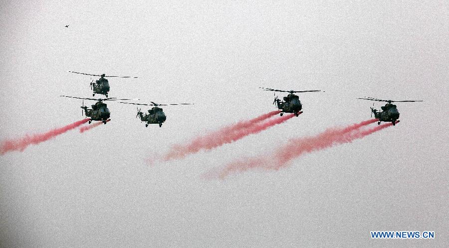 Photo taken on May 20, 2013 shows the South Korea Utility Helicopter (KUH) 'Surion' demonstration flight of maneuver and performance on a media day in Nonsan city, Choongcheongnamdo province of South Korea. (Xinhua/Park Jin hee)