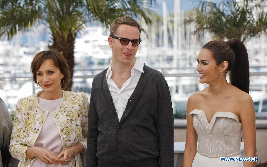 Director Nicolas Winding Refn (C) and actress Kristin Scott Thomas (L), Rhatha Phongam pose during the photocall for the film "Only God Forgives" at the 66th edition of the Cannes Film Festival in Cannes, France, on May 22, 2013. (Xinhua/Zhou Lei) 