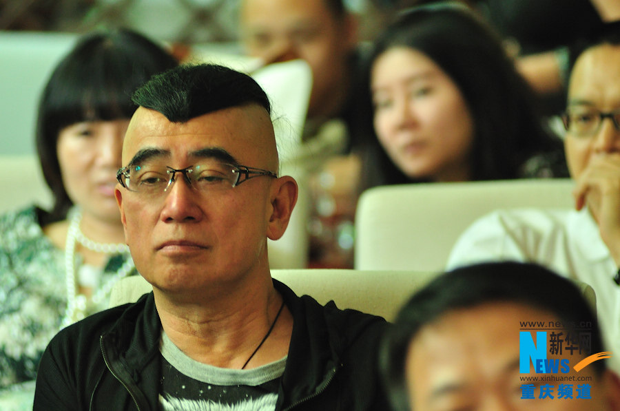 A Salsa enthusiast listens carefully to the background introduction of Salsa dance in a dancing club in Chongqing.