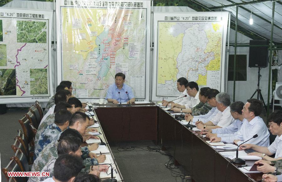 Chinese President Xi Jinping (C) presides over a meeting on earthquake relief work in a tent in southwest China's Sichuan Province, May 21, 2013. Xi made an inspection tour to hard-hit Lushan county and visited local residents from May 21 to May 23. A 7.0-magnitude earthquake hit Lushan on April 20, killing at least 196 people. (Xinhua/Huang Jingwen) 