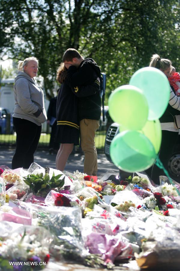 Flowers are seen at the entrance to the Royal Artillery Barracks in Woolwich in southeast London, May 23, 2013. A serving soldier was hacked to death by two attackers wielding knives including a meat cleaver near the Royal Artillery Barracks in Woolwich on Wednesday afternoon. (Xinhua/Bimal Gauta)