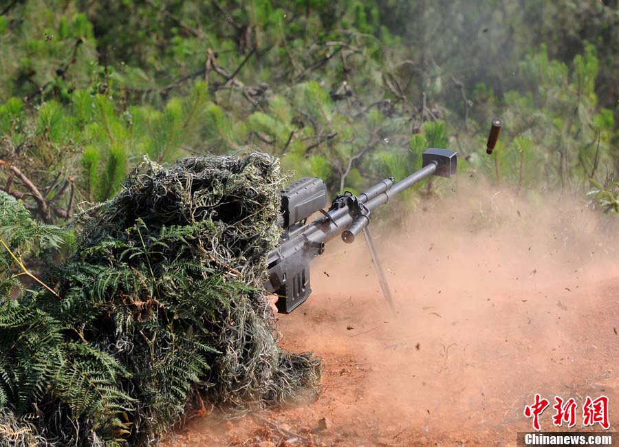 Snipers of the Chinese People's Liberation Army (PLA) participate in military training at a base in Chengdu, Southwest China's Sichuan Province, May 22, 2013. Altogether snipers from over 40 troops of more than 10 corps including the army, navy, air force and the Second Artillery Corps took part in the 40-day training that concluded on Wednesday. [Photo: CNS/Wu Sulin] 