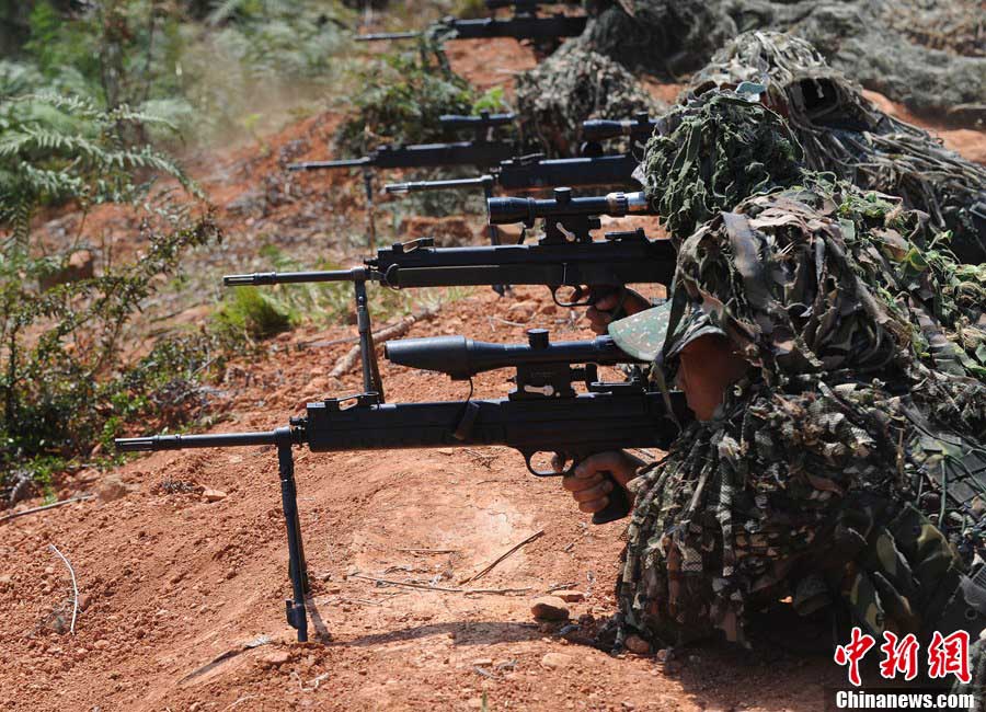 Snipers of the Chinese People's Liberation Army (PLA) participate in military training at a base in Chengdu, Southwest China's Sichuan Province, May 22, 2013. Altogether snipers from over 40 troops of more than 10 corps including the army, navy, air force and the Second Artillery Corps took part in the 40-day training that concluded on Wednesday. [Photo: CNS/Wu Sulin] 