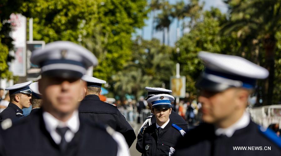 French police officers stand on duty during the 66th Cannes Film Festival in Cannes, France, on May 17, 2013. The film festival runs from May 15 to May 26 this year.(Xinhua/Zhou Lei) 