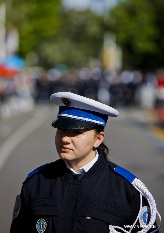 A French police officer stands on duty during the 66th Cannes Film Festival in Cannes, France, on May 17, 2013. The film festival runs from May 15 to May 26 this year.(Xinhua/Zhou Lei) 
