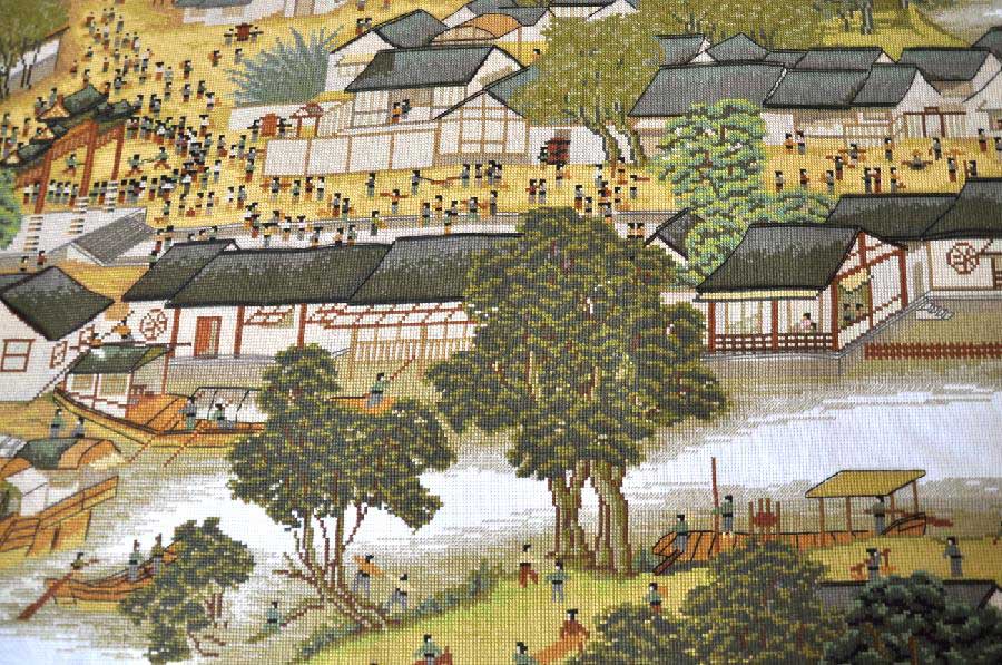 Photo taken on May 22, 2013 shows part of the 22-meter-long cross-stitch work of "Riverside Scene at the Qingming Festival" made by Yang Hua in Yiyuan County, east China's Shandong Province. Yang spent more than three years to finish the cross-stitch. (Xinhua/Zhao Dongshan)