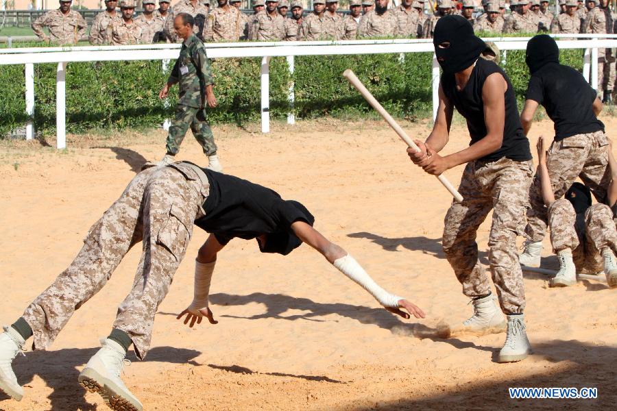 Libyan soldiers take part in a military parade during a graduation ceremony of a new crop of Libyan National Army soldiers, in Tripoli, Libya, May 23, 2013. (Xinhua/Hamza Turkia) 