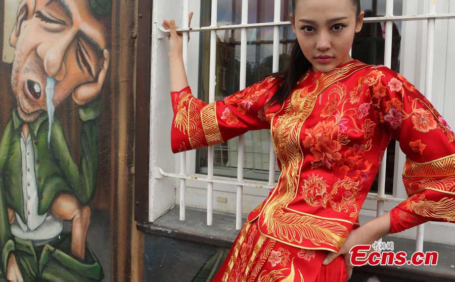 A model presents a "Huafu" dress during the 2013 Berlin Huafu Show in Germany, May 23, 2013. China has a good tradition of great manners, which is called "Xia," while the collection of beautiful dresses of ancientChina, was named "Hua." Huaxia's dress is "Huafu," representing the essence and spirit of China's culture and history. Therefore, "Huafu" is also called China's National Dress. (CNS/Qian Xingqiang)