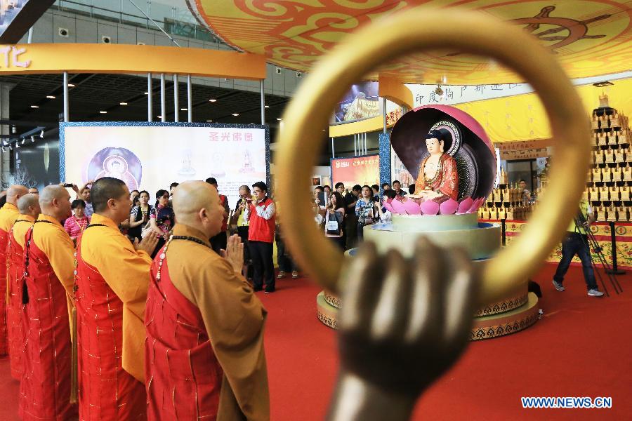 A religious service is held during the China (Nanjing) International Buddhist Cultural Items & Crafts Fair in Nanjing, capital of east China's Jiangsu Province, May 23, 2013. (Xinhua/Han Hua)