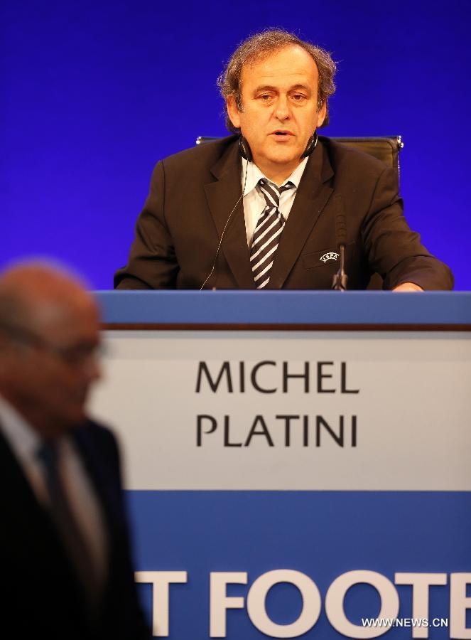 UEFA president Michel Platini (R) addresses the XXXVII Ordinary UEFA Congress 2013 at Grovesnor House Hotel in London, Britain, on May 24, 2013. (Xinhua/Wang Lili) 