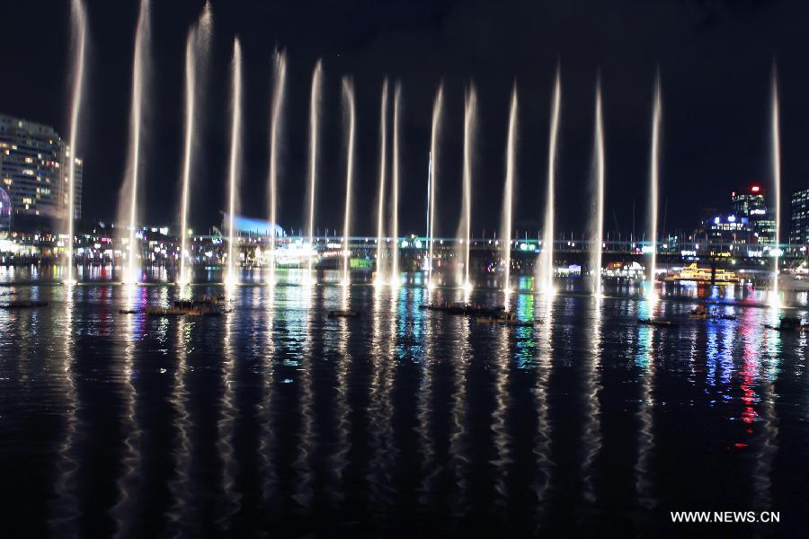 The Darling Harbour is lit up during the Vivid Sydney, a festival of light, music and ideas, in Sydney, Australia, May 24, 2013. (Xinhua/Jin Linpeng) 