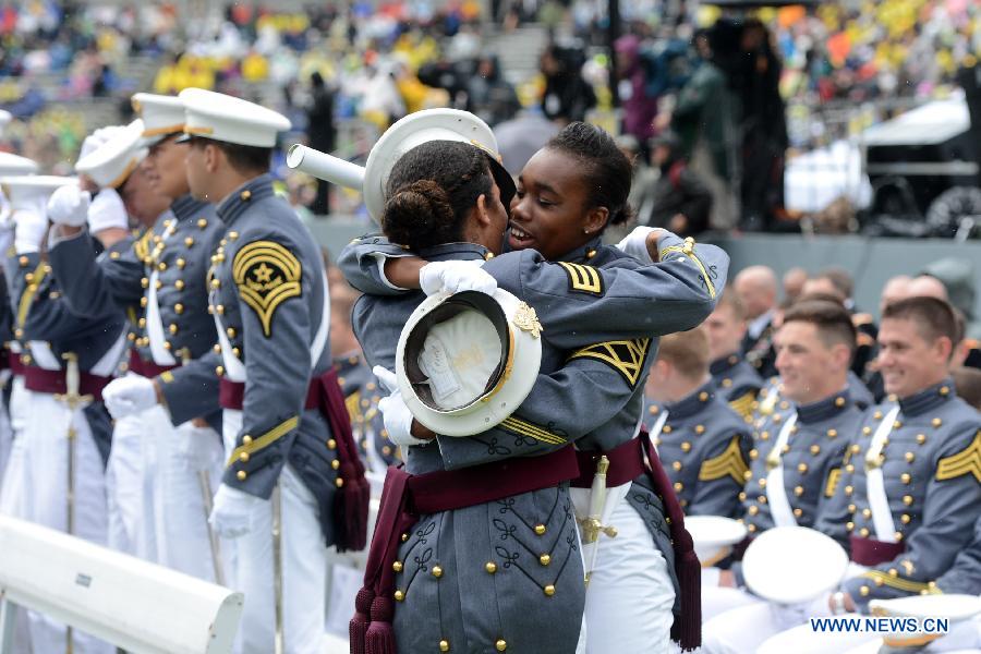 Graduating cadets celebrate with a hug during the graduation ceremonies at the United States Military Academy at West Point, New York, the United States, May 25, 2013. 1,007 cadets graduated on Saturday from the famous military academy founded in 1802. (Xinhua/Wang Lei)