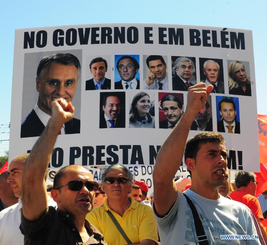 Portuguese demonstrators protest against the government's implementation of tough austerity measures in Lisbon on May 25, 2013. Thousands of Portuguese from cities including capital Lisbon, Porto, Vila Real, Setubal and Sintra gathered in front of the Jeronimos Monastery in Lisbon on Saturday protesting against government's austerity measures in return for the bailout from the troika comprising the European Union, the European Central Bank and the International Monetary Fund. (Xinhua/Zhang Liyun) 