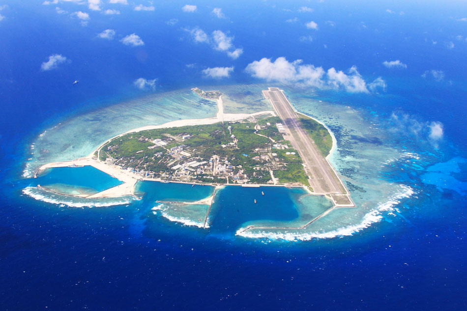 An aerial view of Yongxing Island, the location of the People's Government of Sansha City, is presented on May 20, 2013. Sansha city, established on June 21, 2012, is China's southernmost island, covering 13 square kilometers' land and sea area of about 2.6 million square kilometers. (Xinhua Photo/ Zha Chunming)