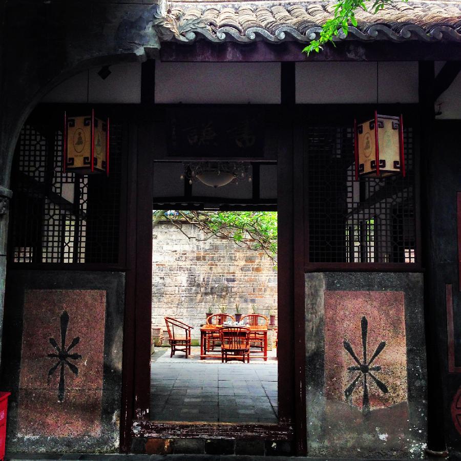 A compound built in the Republic of China (1911-1949) is seen in Anren, an ancient town in Dayi County of Chengdu, capital of southwest China's Sichuan Province, May 23, 2013. Anren Town was first built in ancient China's Tang Dynasty (618-907). Most of its buildings were constructed in late Qing Dynasty (1644-1911) and early Republic of China. Chengdu will host the Global Fortune Forum, an event to be organized by the American magazine "Fortune", on June 6-8. (Xinhua/Shen Hong) 