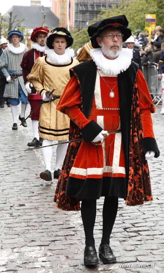 People in mediaeval style dresses attend the Ducasse de Mons or Doudou celebration in Mons, Belgium, May 26, 2013. The popular festival, originating in the Middle Ages and depicting the combat between Saint George and a dragon, is recognized by UNESCO as one of the Masterpieces of the Oral and Intangible Heritage of Humanity. (Xinhua/Wang Xiaojun) 