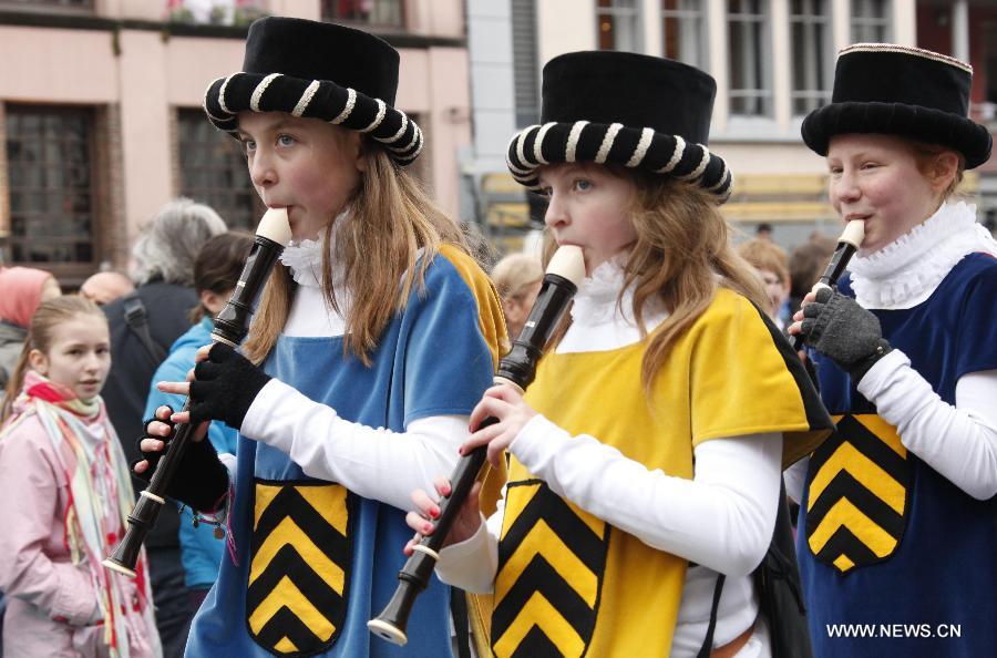 Girls in mediaeval style dresses attend the Ducasse de Mons or Doudou celebration in Mons, Belgium, May 26, 2013. The popular festival, originating in the Middle Ages and depicting the combat between Saint George and a dragon, is recognized by UNESCO as one of the Masterpieces of the Oral and Intangible Heritage of Humanity. (Xinhua/Wang Xiaojun) 