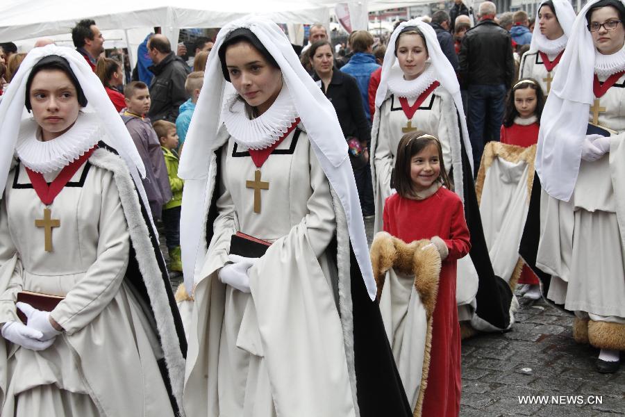 Girls in mediaeval style dresses attend the Ducasse de Mons or Doudou celebration in Mons, Belgium, May 26, 2013. The popular festival, originating in the Middle Ages and depicting the combat between Saint George and a dragon, is recognized by UNESCO as one of the Masterpieces of the Oral and Intangible Heritage of Humanity. (Xinhua/Wang Xiaojun)