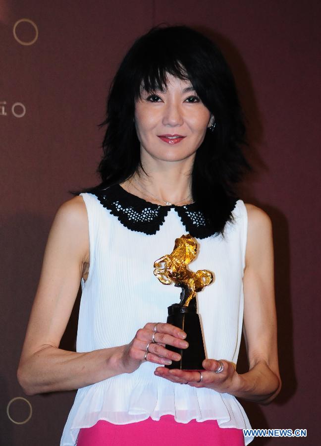 Actress Maggie Cheung attends a press conference marking the beginning of the 50th anniversary celebration of the Golden Horse Film Festival in Taipei, southeast China's Taiwan, May 27, 2013. Maggie Cheung, the actress who won the most Golden Horse Awards so far, is appointed as the 2013 Golden Horse Film Festival Ambassador on Monday. (Xinhua) 