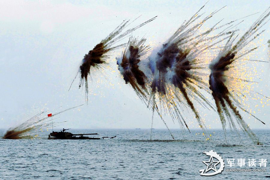 An amphibious armored brigade under the Nanjing Military Area Command (MAC) of the Chinese People's Liberation Army (PLA) takes its troops to unfamiliar area on May 26, 2013 to conduct live-ammunition firing training. (China Military Online/Jiang Jiangao)