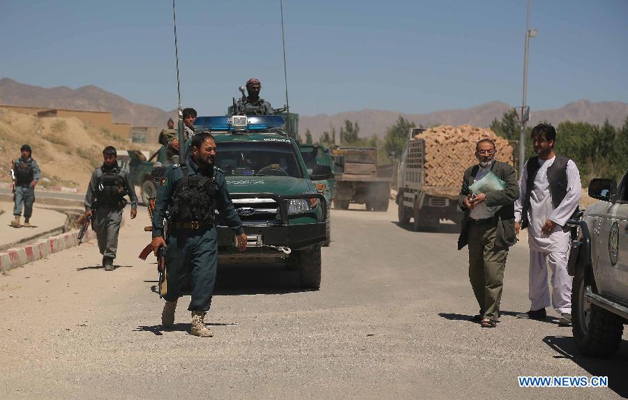 Afghan policemen stand guard at the site of blast in Ghazni city, Afghanistan, on May 29, 2013. Earlier on Wednesday, four people, including three school girls, were wounded when two back-to-back Improvised Explosive Devices ( IEDs) went off near a girl school in Ghazni city, the provincial capital of eastern Ghazni province 120 km south of capital Kabul. (Xinhua/Rahmat) 