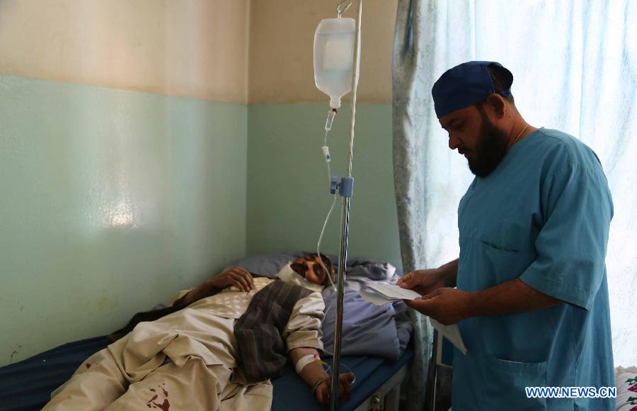 An wounded man receives treatment at a hospital in Ghazni city, Afghanistan, on May 29, 2013. Earlier on Wednesday, four people, including three school girls, were wounded when two back-to-back Improvised Explosive Devices ( IEDs) went off near a girl school in Ghazni city, the provincial capital of eastern Ghazni province 120 km south of capital Kabul. (Xinhua/Rahmat) 