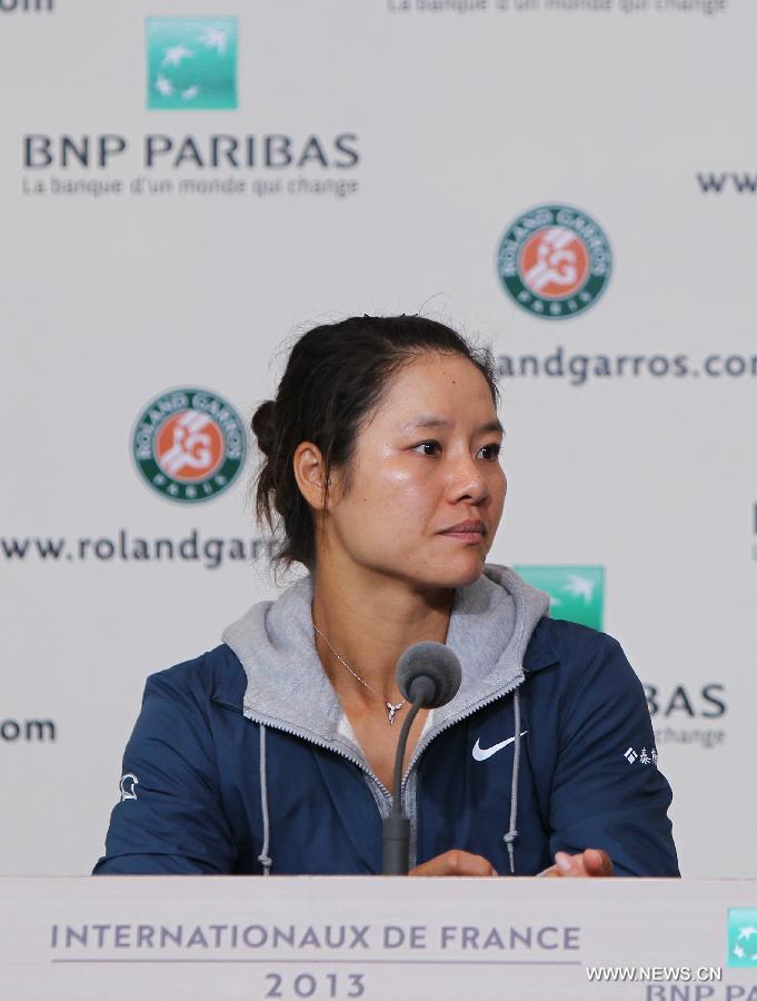 Li Na of China reacts during the news conference after the women's singles second round match against Bethanie Mattek Sands of the United States at the French Open tennis tournament at the Roland Garros stadium in Paris, France, May 30, 2013. Li Na lost the match 1-2. (Xinhua/Gao Jing)