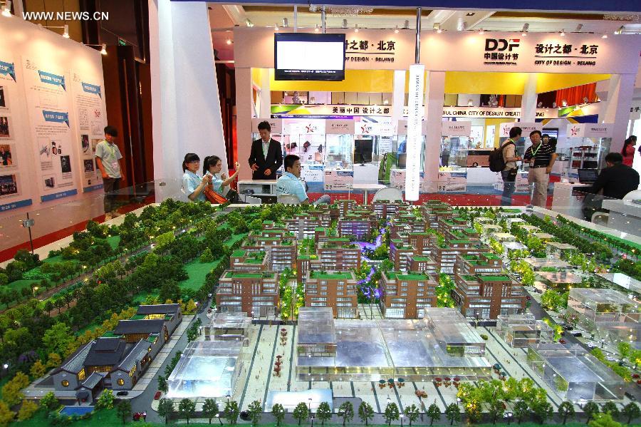 Photo taken on May 29, 2013 shows the model of the project "China Design Valley," which is planned to be built in the Daxing District of Beijing, at the China Design Festival in Beijing, capital of China, May 29, 2013. The China Design Festival, which kicked off on May 30, will last until June 1. (Xinhua) 