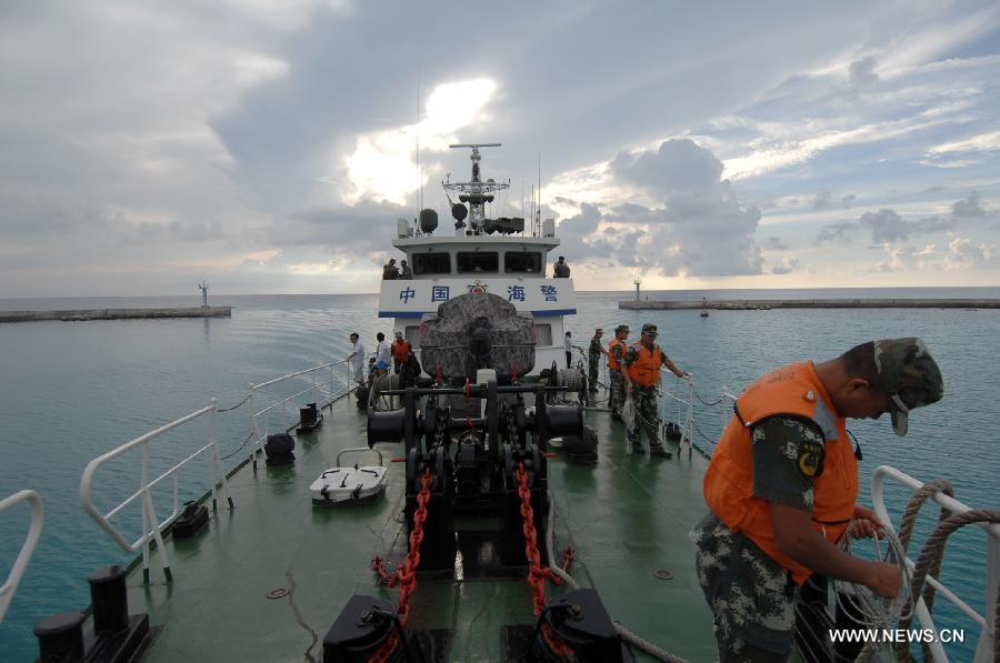 China Coast Guard vessel 46001 arrives at the Yongxing Island of Sansha City after it finished the patrol mission, south China's Hainan Province, May 31, 2013. The vessel accomplished a 10-hour patrol of the sea areas around Yongle Islands on Friday. (Xinhua/Wei Hua)