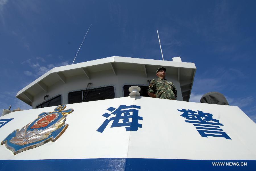 A marine officer looks out on the China Coast Guard vessel 46001, south China's Hainan Province, May 31, 2013. The vessel accomplished a 10-hour patrol of the sea areas around Yongle Islands on Friday. (Xinhua/Wei Hua)