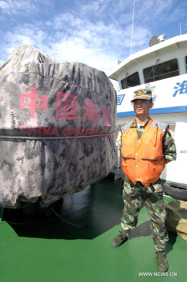 A marine officer is on duty on the China Coast Guard vessel 46001, south China's Hainan Province, May 31, 2013. The vessel accomplished a 10-hour patrol of the sea areas around Yongle Islands on Friday. (Xinhua/Wei Hua)