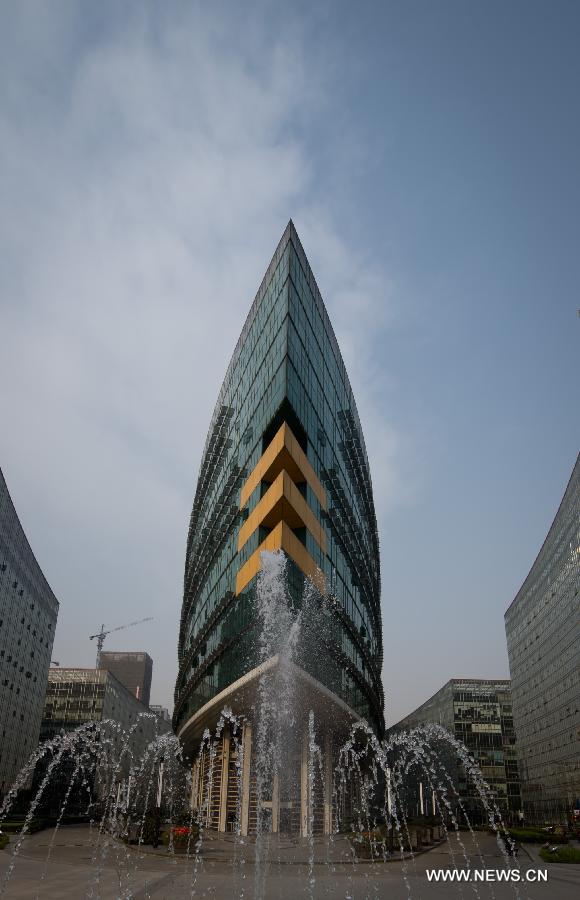 Photo taken on March 5, 2013 shows the building of the high-tech zone administrative committee in Chengdu, capital of southwest China's Sichuan Province. By the end of 2012, Chengdu's GDP has reached 800 billion RMB (about 130.48 billion U.S. dollars), ranking the 3rd place in China's sub-provincial cities. By May of 2013, more than 230 enterprises in the Fortune 500 have come to Chengdu. The 2013 Fortune Global Forum will be held in Chengdu from June 6 to June 8. Chengdu, an ancient city with a history of over 2,300 year, is developing into an international metropolis with its huge economic development potential as well as its special cultural environment. (Xinhua/Jiang Hongjing)